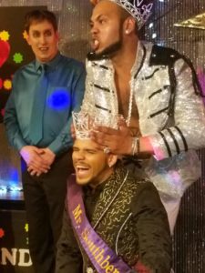 Outgoing Mr. Southbend 2017, Isaac Ismael, crowns the new Mr. Southbend 2018, Adonis Vayne. Contestant Draco DK looks on in the background. [Southbend Tavern - Columbus, Ohio on March 25th, 2018]