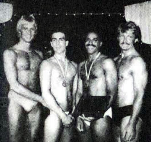 "We Are Family" - Masculine excellence gathers at the fourth annual Mr. Gay All-American Contest in July 1986 at the Old Plantation in Dallas, as the first three national titleholders welcome the newest member to their brotherhood. From left: MGAA 1985 Keith Mitchell; MGAA 1986 Ered Matthew; MGAA 1987 Medwin Johnson; and MGAA 1984 Ron East.