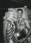 Moments after claiming the title of Mr. Gay All-American 1987, Medwin Johnson is congratulated by then-reigning Miss Gay America 1986, Lauren Colby.