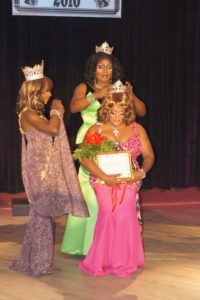 Gizelle Bevon Ashton being crowned Miss Gay Texas America 2010 by Onyx (Miss Gay Texas America 2009). Coco Montrese (Miss Gay America 2010) is a assisting (left).
