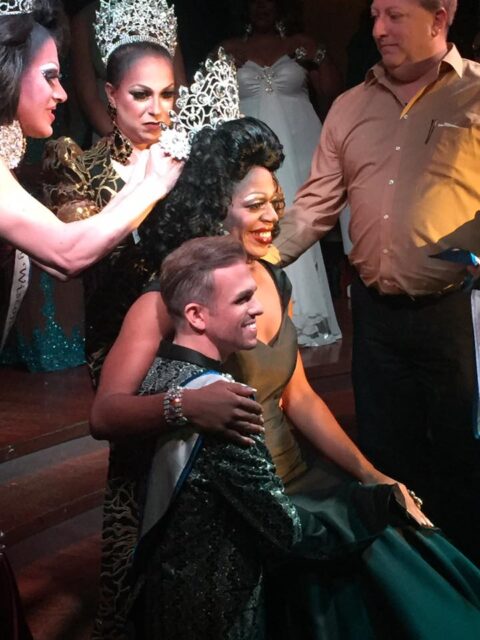 Domita DeBaun Sanchez being crowned Miss Gay Wisconsin USofA Newcomer at Five Nightclub & Showbar in Madison, Wisconsin on 11/20/2016. Directly behind Domita (center) is Vanity St. James who was the reigning Miss Gay USofA Newcomer at the time.