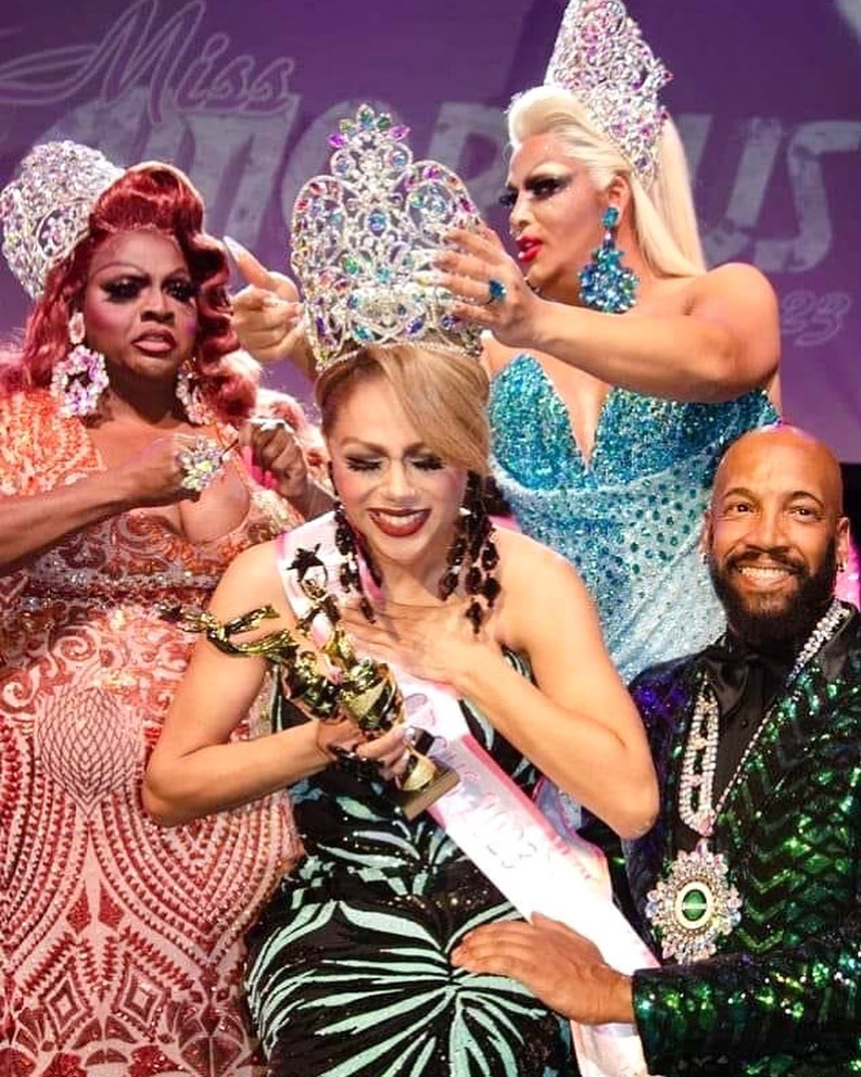 Crowning Moment.  Antonio Edwards lends a knee as Sofia Andrews is crowned the new Miss Glamorous by Nicole T. Phillips and Roxxxy Andrews. | Miss Glamorous Pageant | The Plaza Live (Orlando, Florida) | 3/20/2023